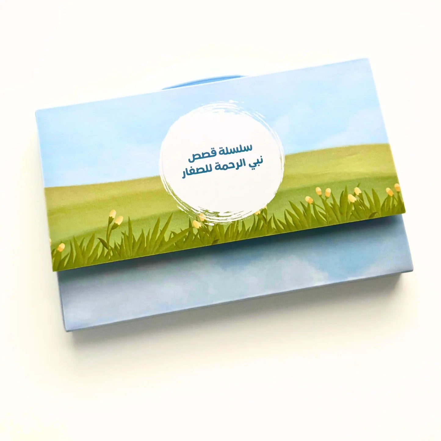 Card with a blue sky and green grass design on a white background