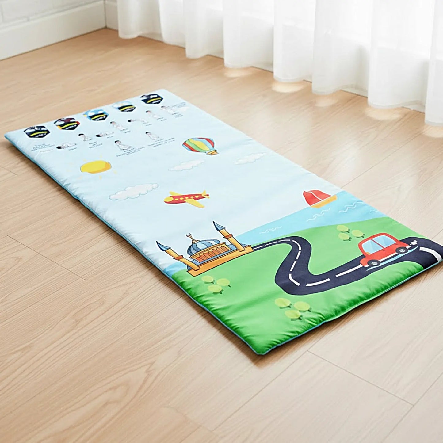 Children's play mat with cartoon designs on a wooden floor